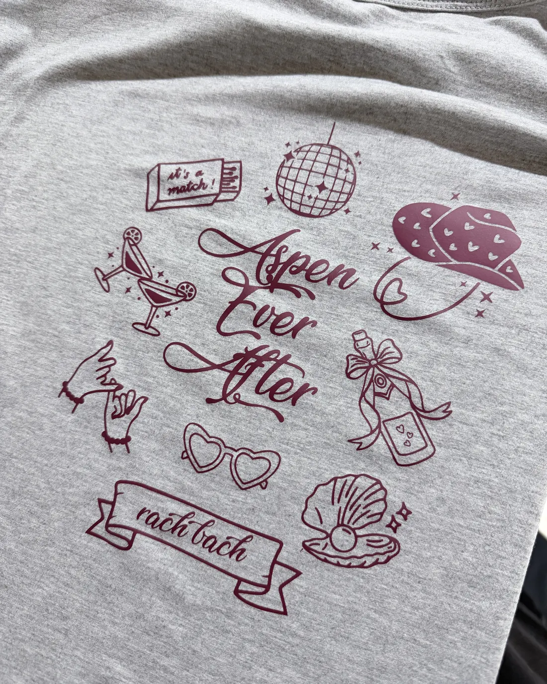 Grey tee with a hand-drawn bachelorette weekend design