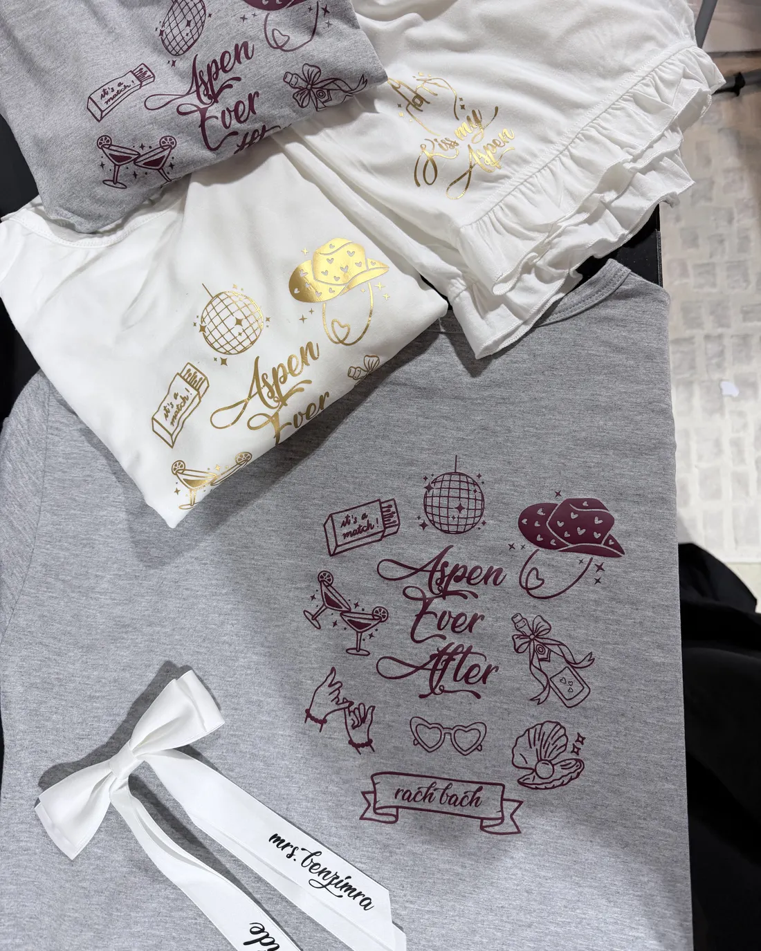 Grey tee with a hand-drawn bachelorette weekend design